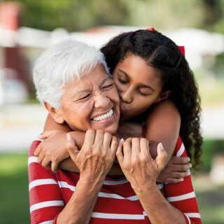 Girl hugging her grandmother