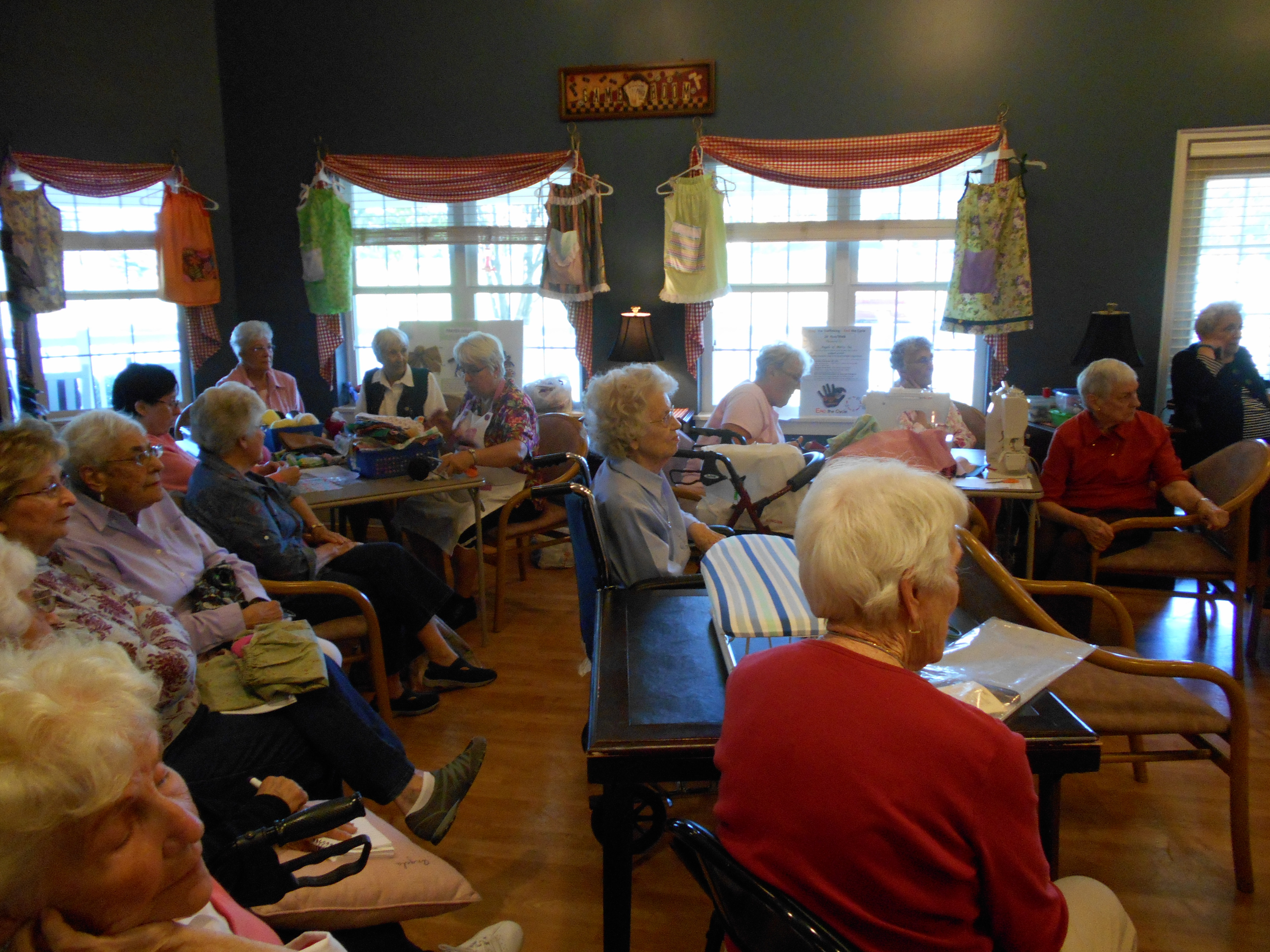 Residents listen to the presentation from Angels of Mercy.