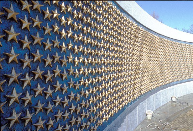 The Field of Stars at the WWII Memorial. There are 4,048 gold stars; each one represents 100 American military deaths. That means that more than 400,000 soldiers, sailors, marines, airmen, and military personnel lost their lives or remain missing in action in World War II. Of 16 million men and women in military service during the time, that number represents 1 death out of every 40. When an American went off to fight, the family often displayed in their window a flag bearing a blue star on a white field with a red border. If one of those dreaded telegrams arrived informing them of their family member's death, they would replace the blue star with a gold one; revealing that family’s sacrifice. “Here We Mark The Price Of Freedom” is inscribed below the Freedom Wall.