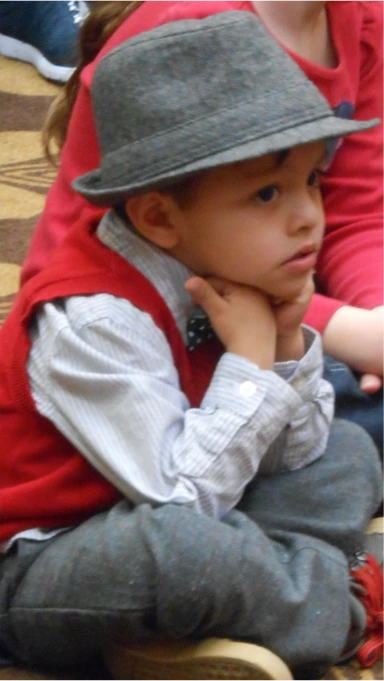 A preschooler waits to sit on Santa's lap during the Fountain View Village Christmas Program.