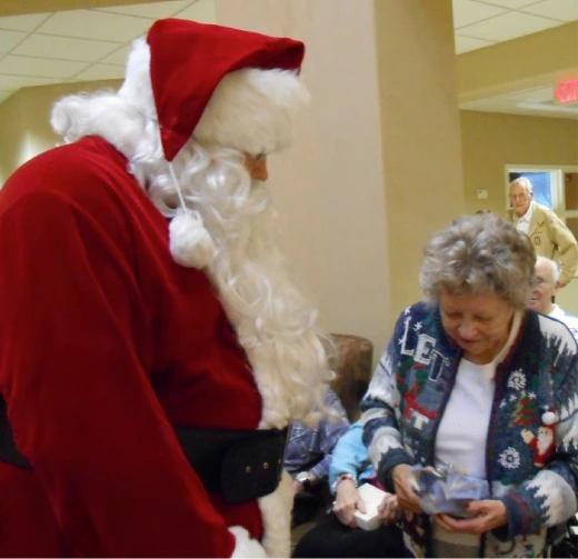 Jaunita and Santa during the White Elephant Gift Exchange