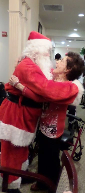 santa hugging resident in texas