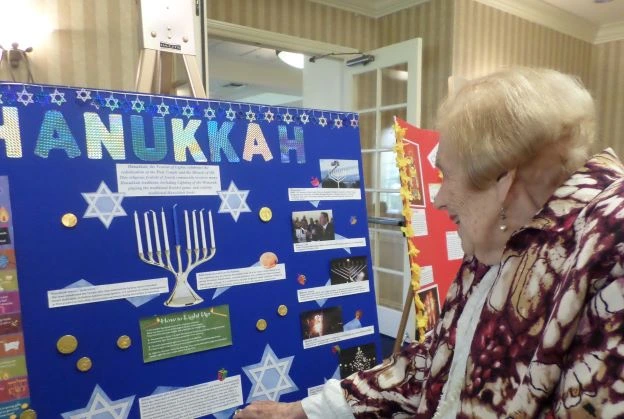 senior learning about hanukkahku