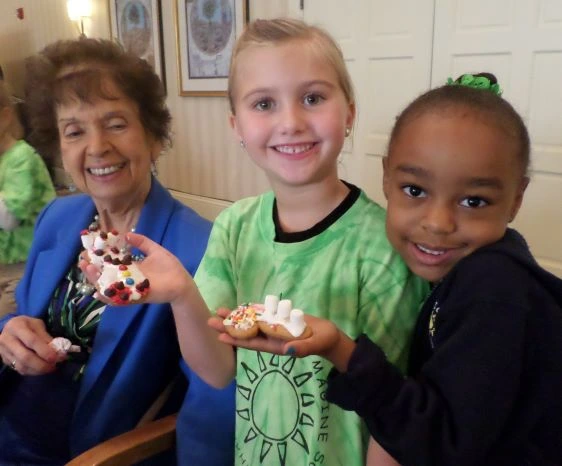 Children making Christmas cookies for the seniors