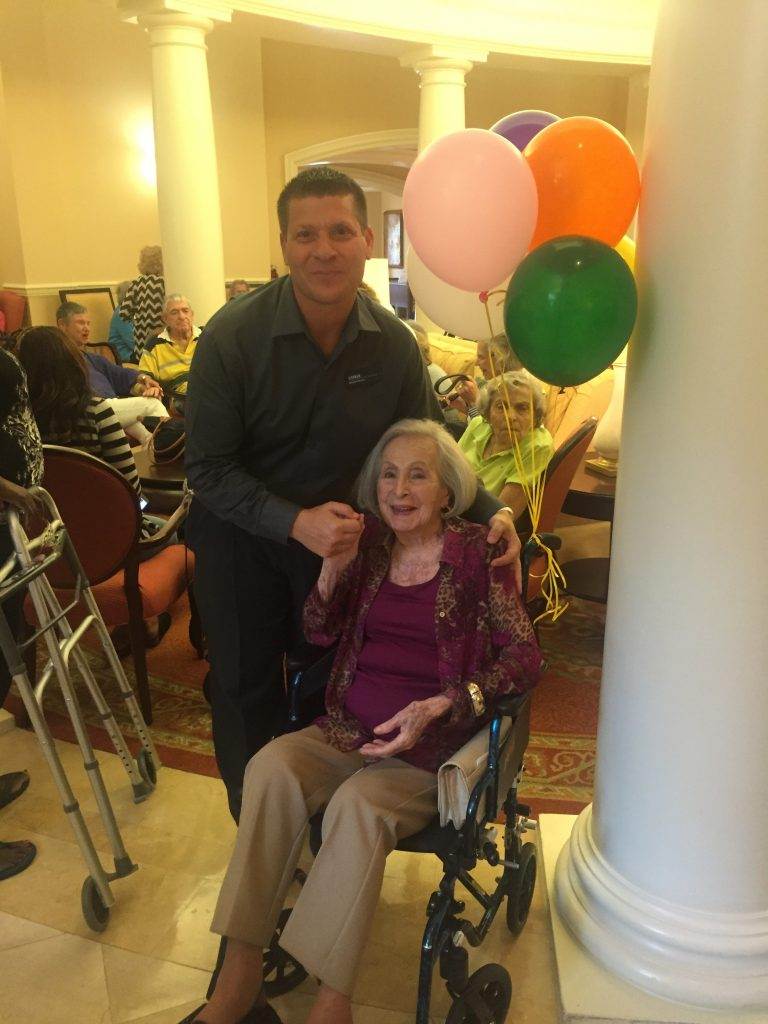 Executive Director Chris Kochan shares a moment with Bette on her 104th birthday