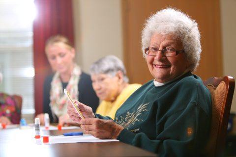 women reading brochure