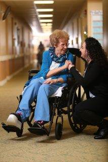 nurse talking with an assisted living resident