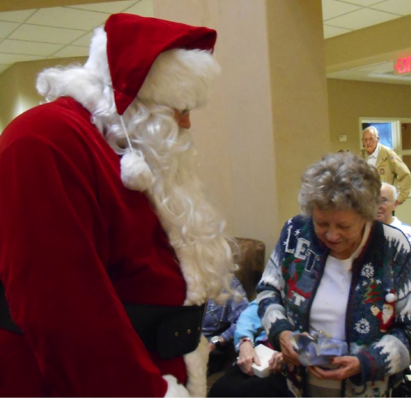 Jaunita and Santa during the White Elephant Gift Exchange