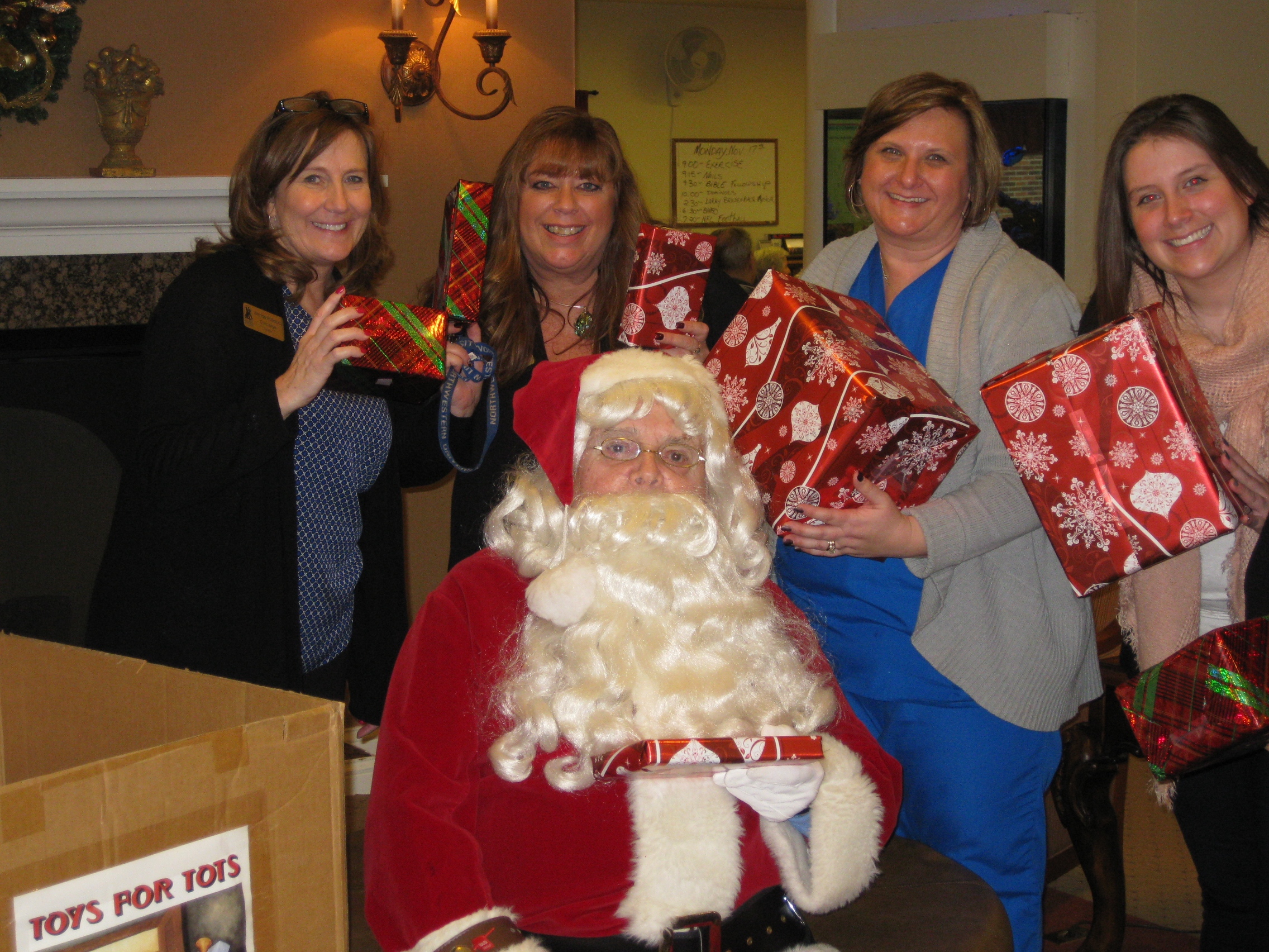 Santa and his helpers collect Toys for Tots donations