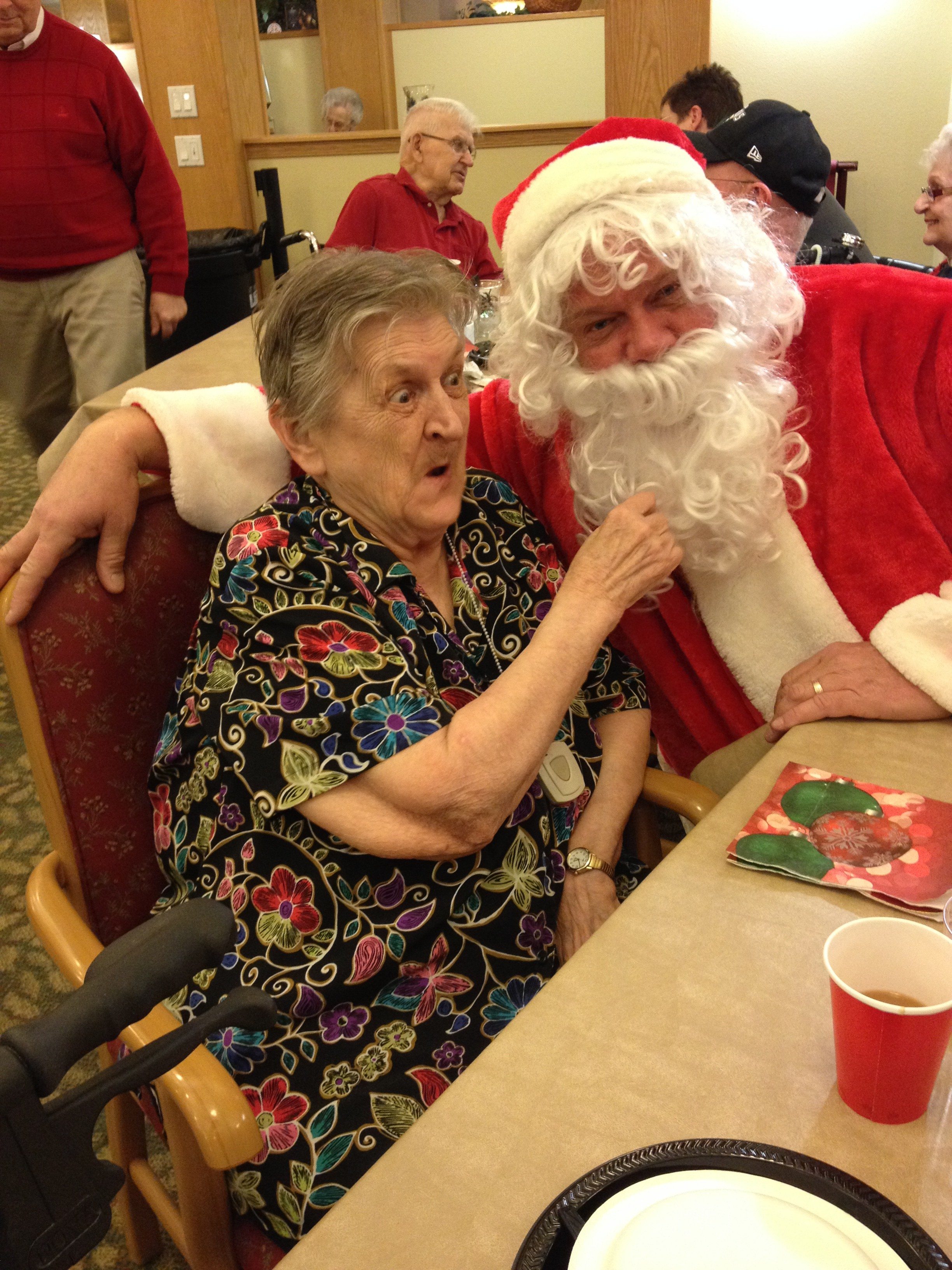 Dorothy tugs Santa's beard to make sure he's the real deal