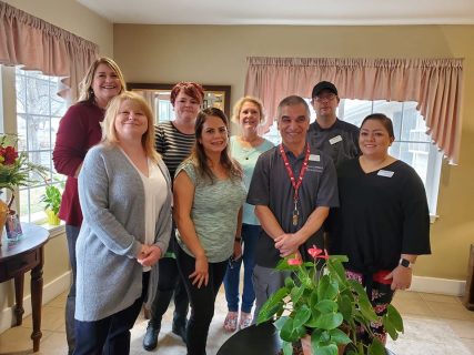 Senior Lifestyle Staff Smiling for a Group Photo