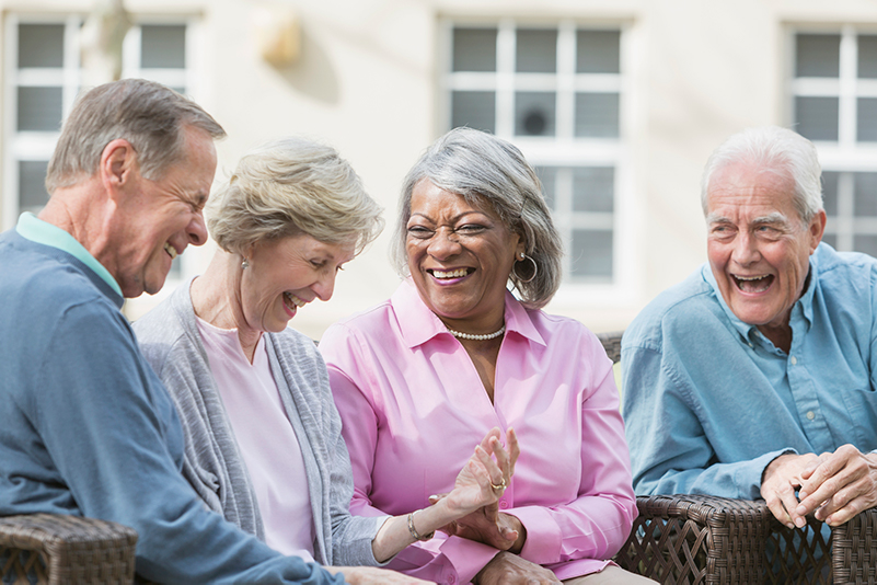 A group of four seniors enjoying each other's company.