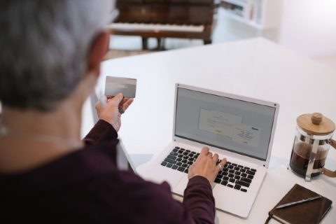 A senior is about to give his credit card information online.