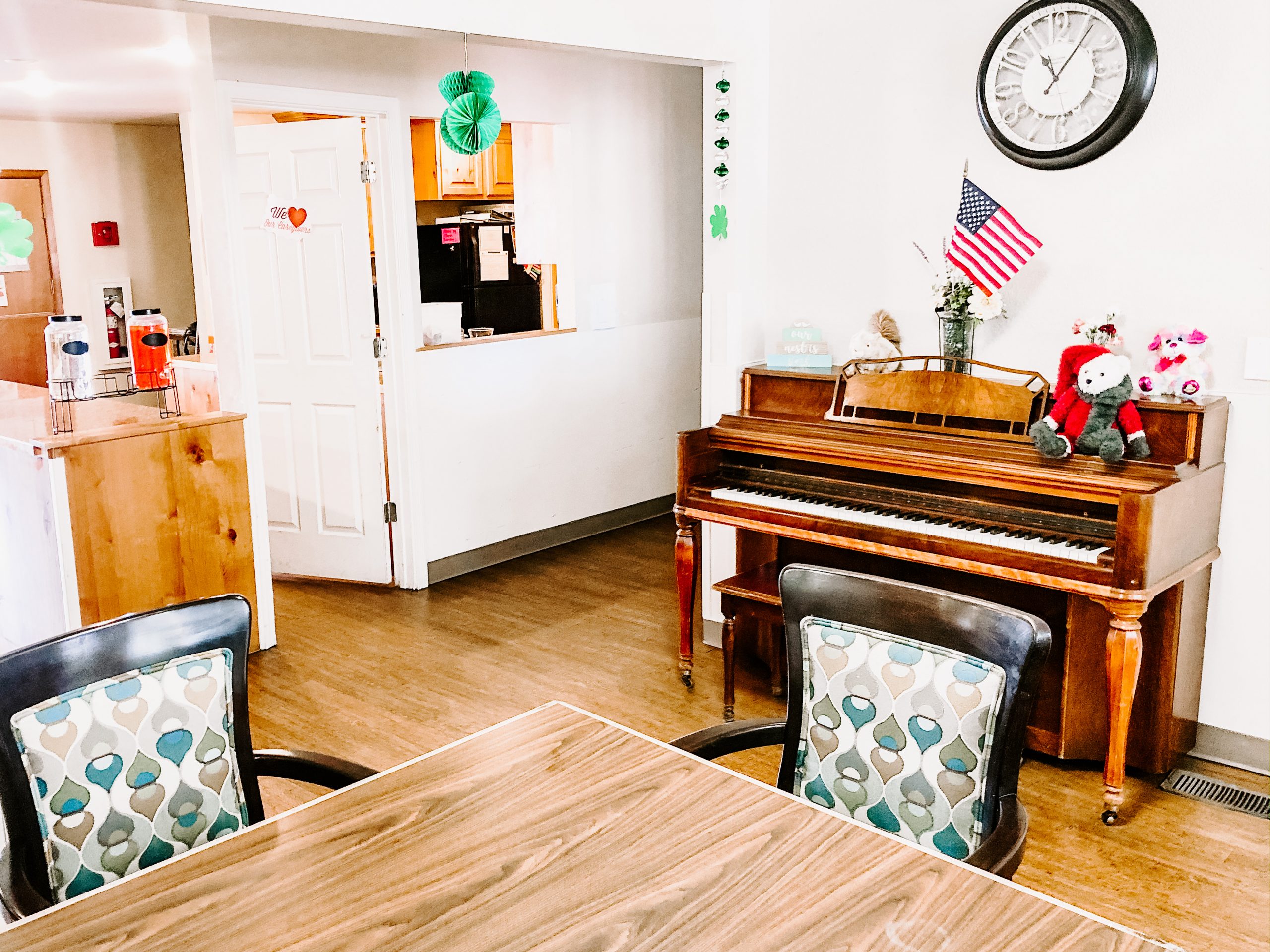 Copper springs shared living area with seating and a piano