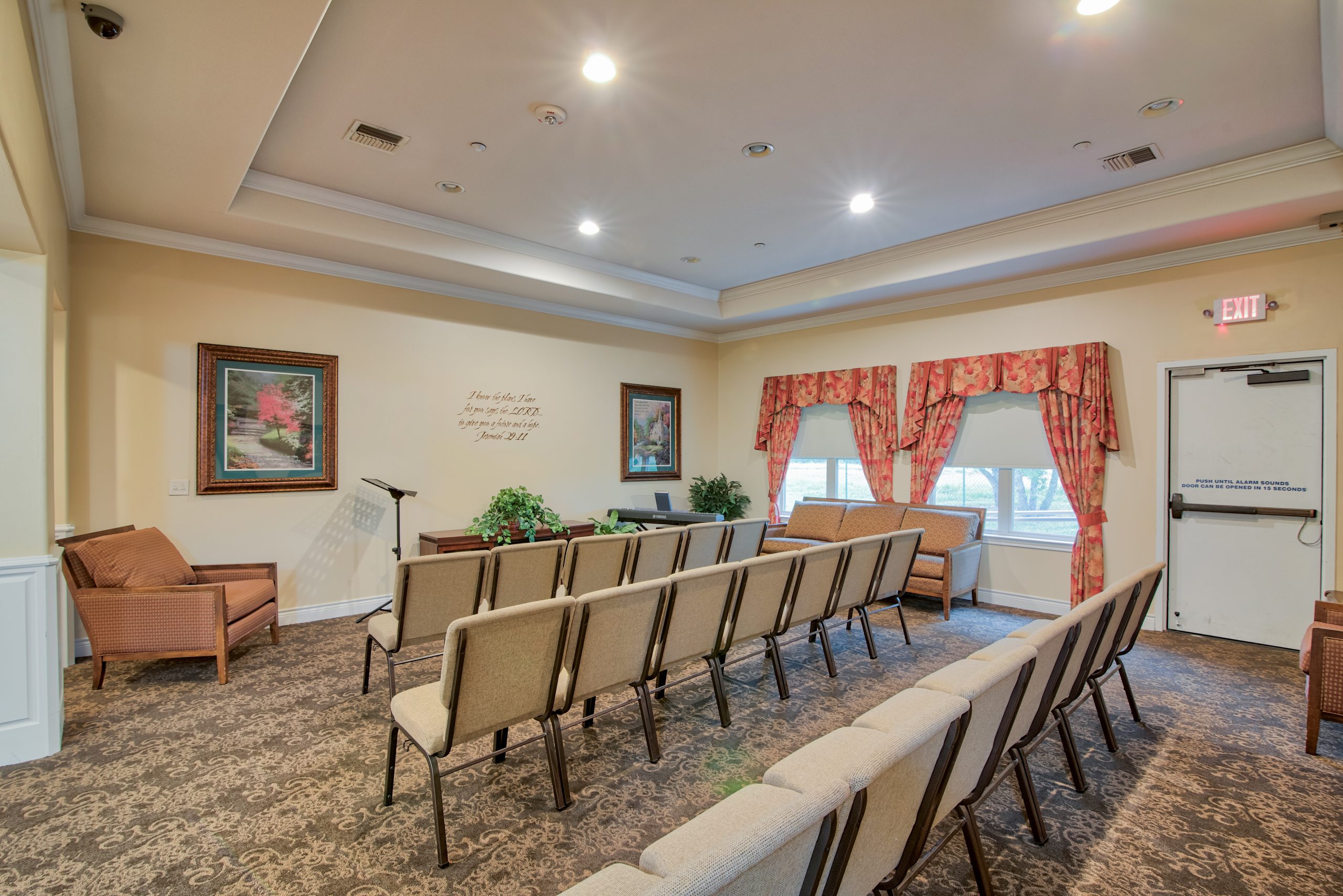 Pelican bay assisted living memory care community meeting area with chairs