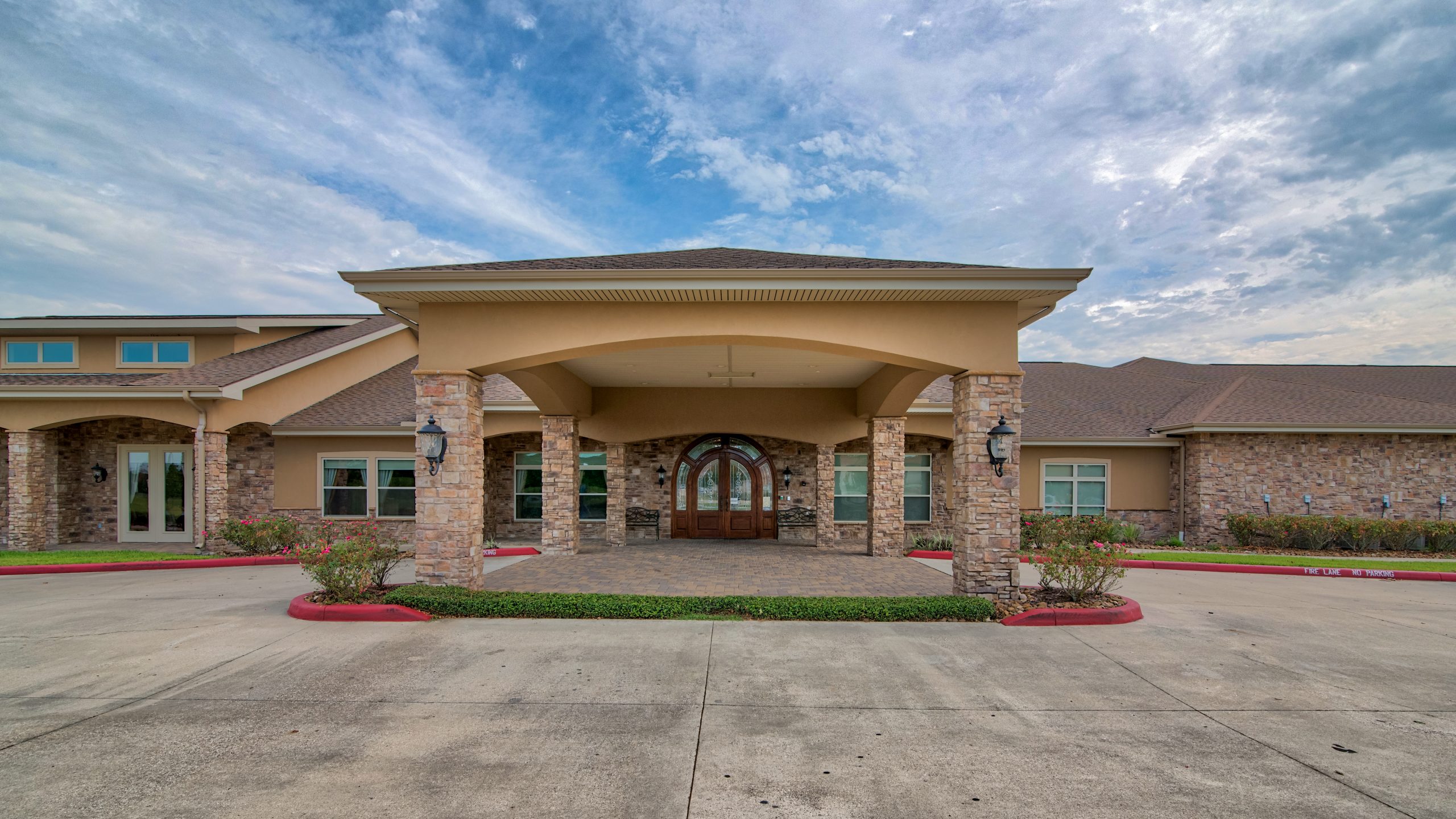 Pelican bay assisted living memory care community outdoor front entrance