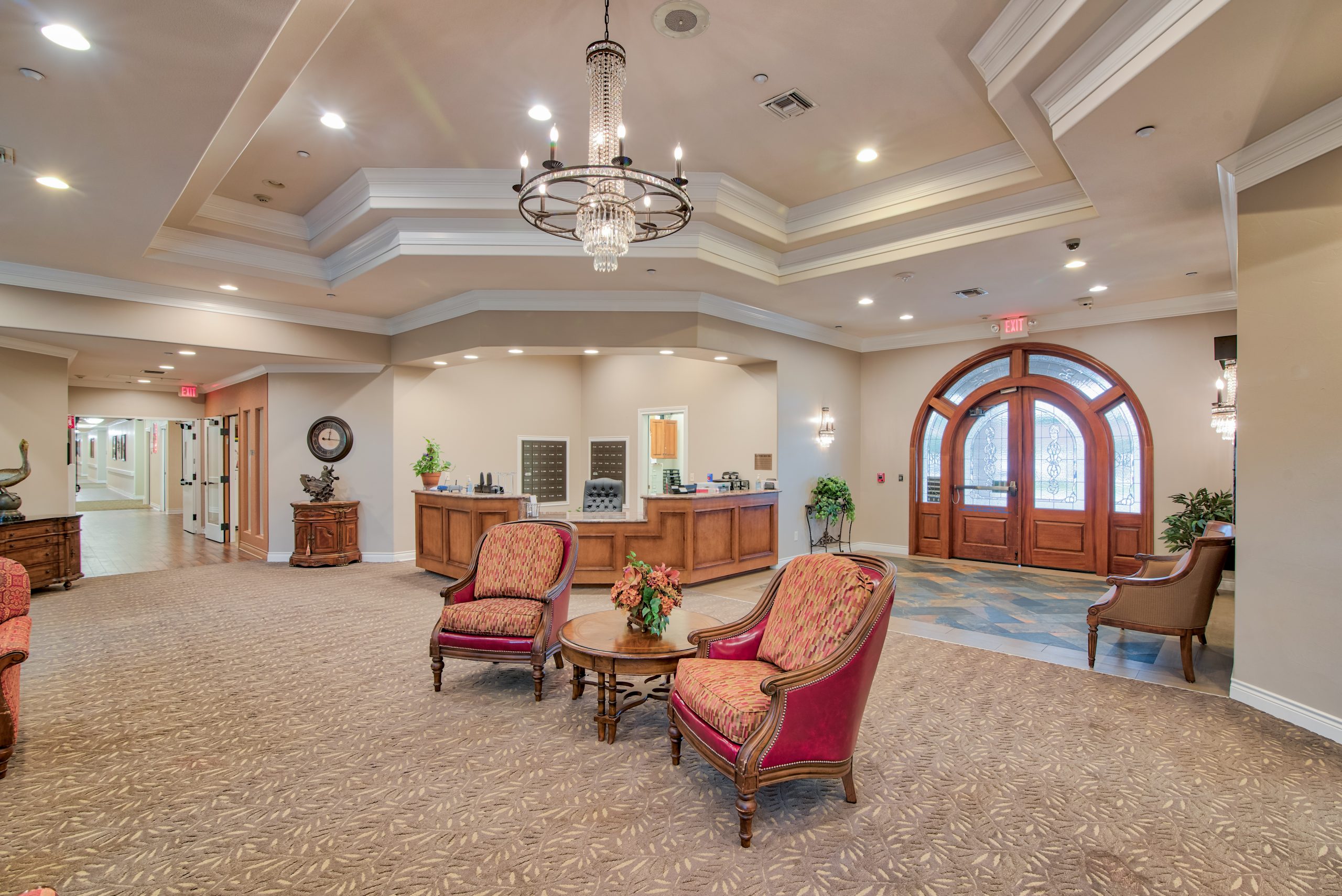 Pelican bay assisted living open living area with chairs memory care community