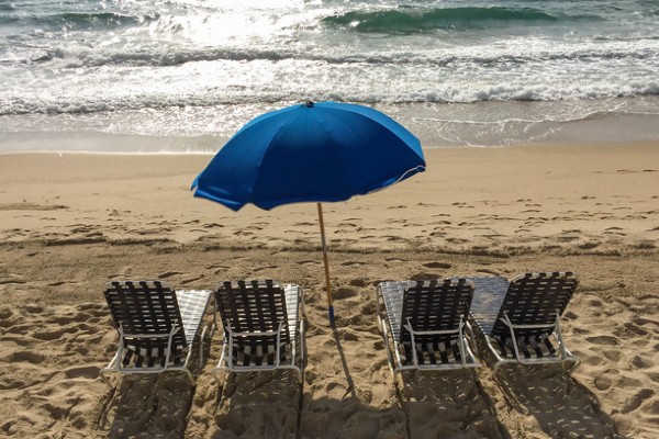 Chairs along the beautiful Lantana beach await visitors.
