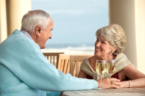 A North Carolina senior couple relaxes with some wine.