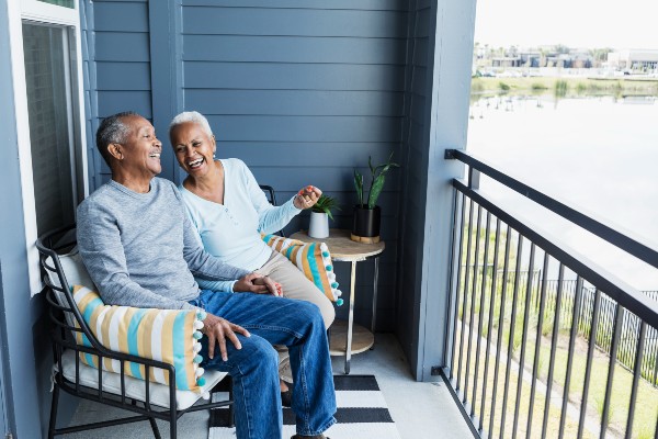 A senior couple relaxes on a porch in Florida.