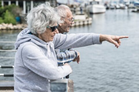 Seniors look out from a pier at Irondequoit Bay near Rochester, NY