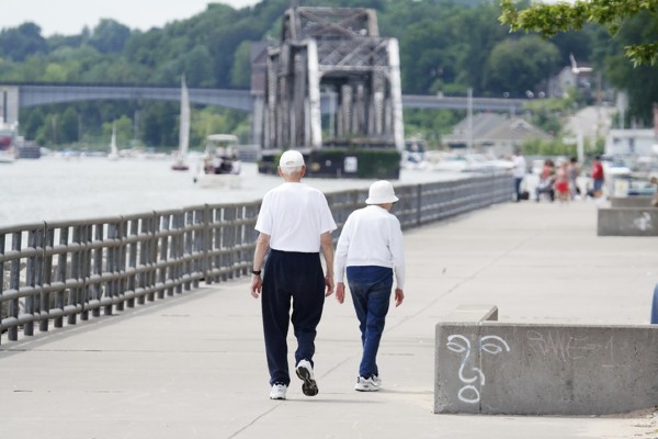 Seniors walk along a pier in nearby Rochester, NY