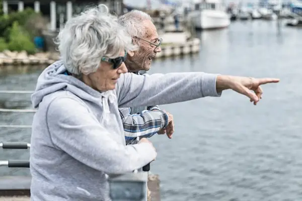 Seniors look out from a pier at Irondequoit Bay near Rochester, NY