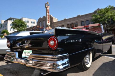 A 1957 Ford Fairlane sits at the Woodward Cruise in Birmingham, MI.