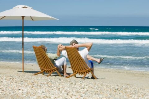 A retired couple enjoys the beach in Florida.