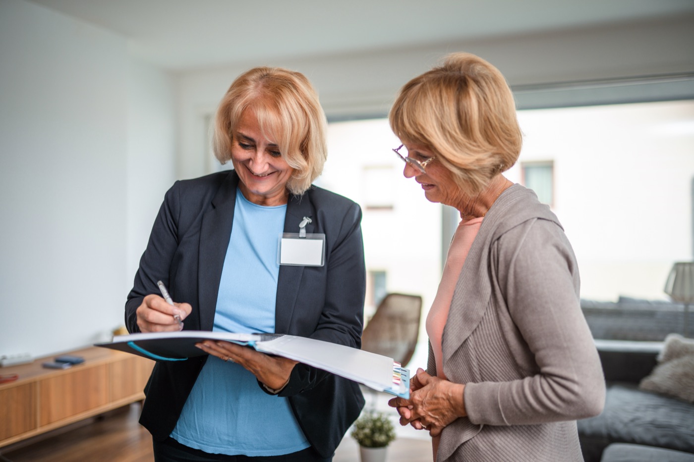 Caucasian Female Healthcare Worker Counseling With a Senior Adult Female Patient at Home