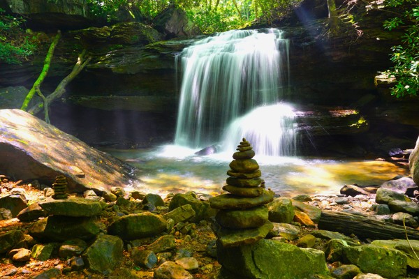 A stack of stones sits next to a waterfall in Ohiopyle State Park in nearby Ohiopyle.