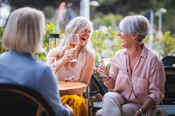 Senior women enjoy a drink in a restaurant in Indiana, PA.