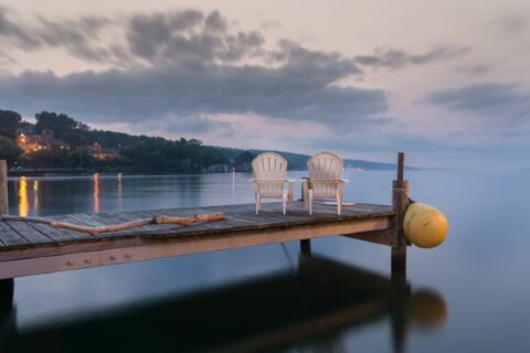 Two chairs form a tranquil scene at one of the Finger Lakes near Henrietta and Rochester, NY.