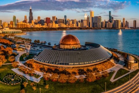 The Adler Planetarium sits looking at nearby downtown Chicago.