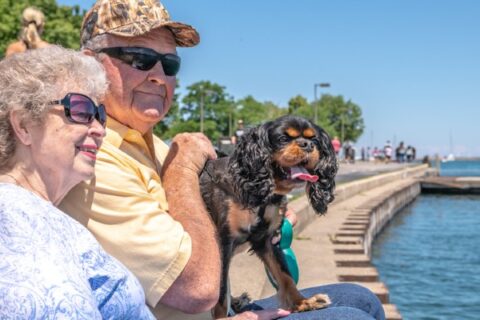 A senior couple visits a Chicago-area lake with their dog.