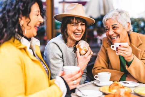 Senior women enjoy coffee at a cafe in Rochester.