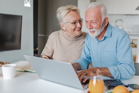 A senior couple works through their finances.