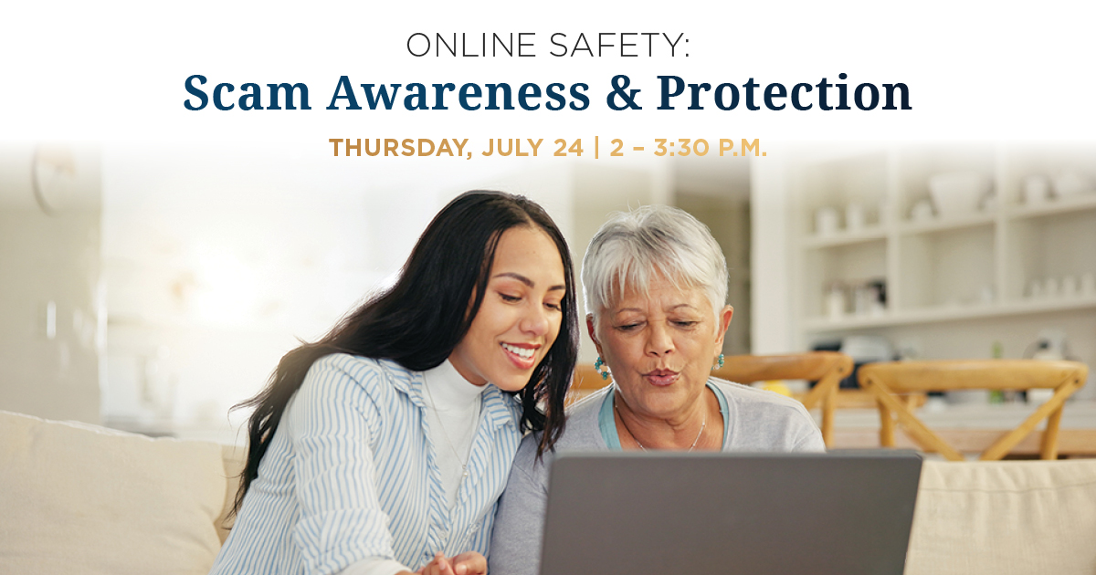 A younger women helping an older women on the computer.
