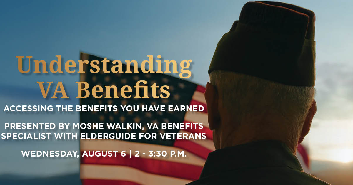 An older veteran standing in front of the American flag.
