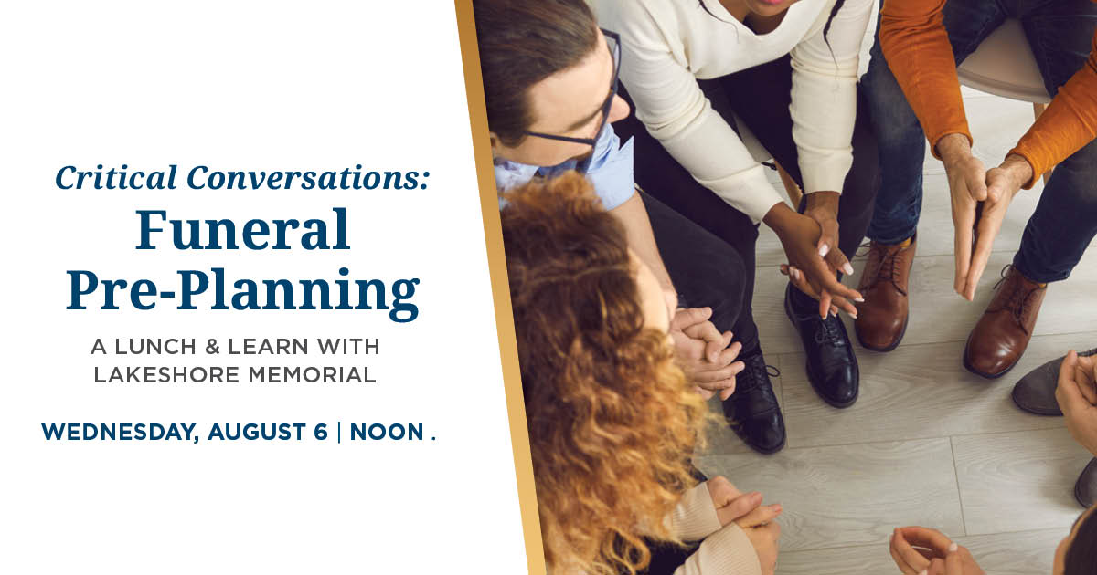 A group of people talking with one another.