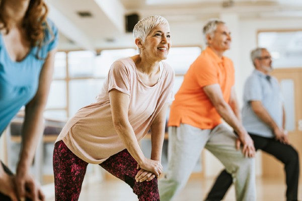 Group of seniors engaging in an exercise class together.