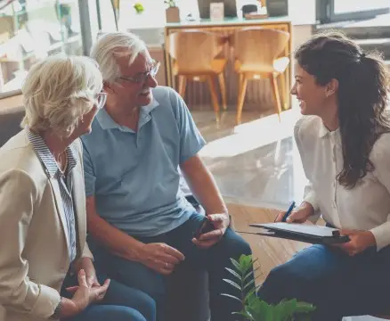 Senior residents discussing finances with financial advisor