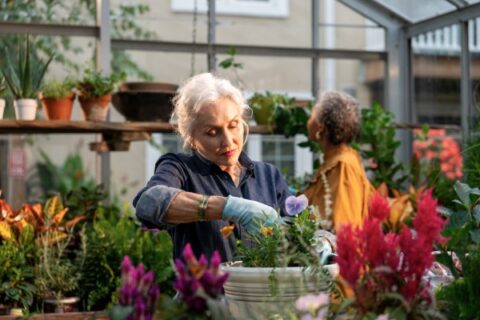 A woman tends her garden.