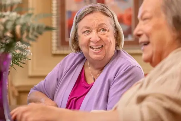 A senior chats with her friend.