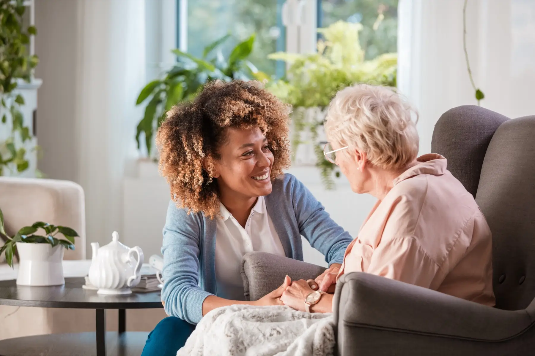 Friendly nurse supporting an elderly lady Friendly nurse supporting an elderly lady