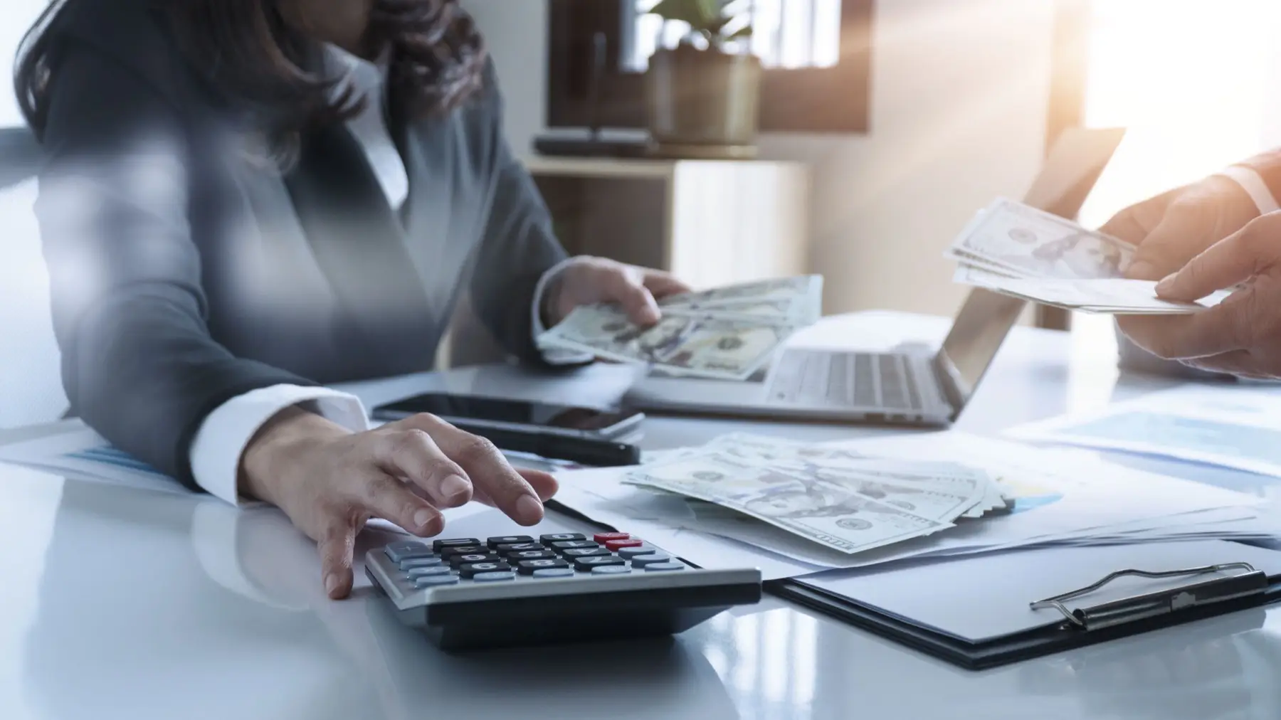 Business woman meeting and using a calculator to calculating and analyzing data, Investment consultant, Business advisor finance and accounting. Business woman meeting and using a calculator to calculating and analyzing data, Investment consultant, Business advisor finance and accounting.