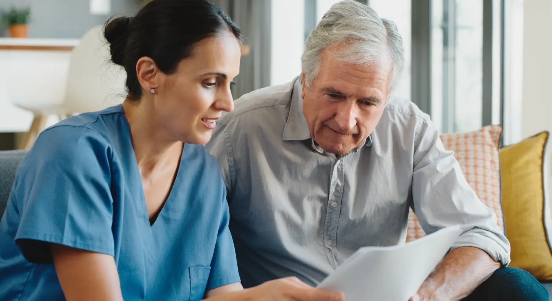Doctor, healthcare worker and medical nurse helping senior man with paperwork for health insurance, planning for retirement and pension finance document. Elderly person getting help with bills