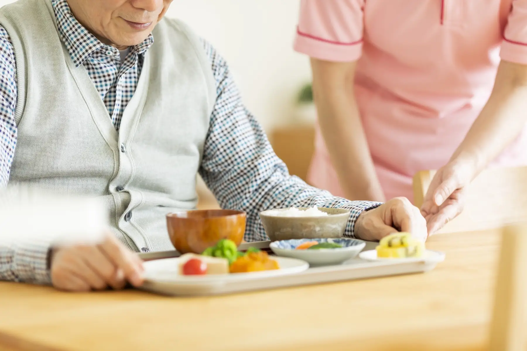 Caregiver preparing a meal Caregiver preparing a meal