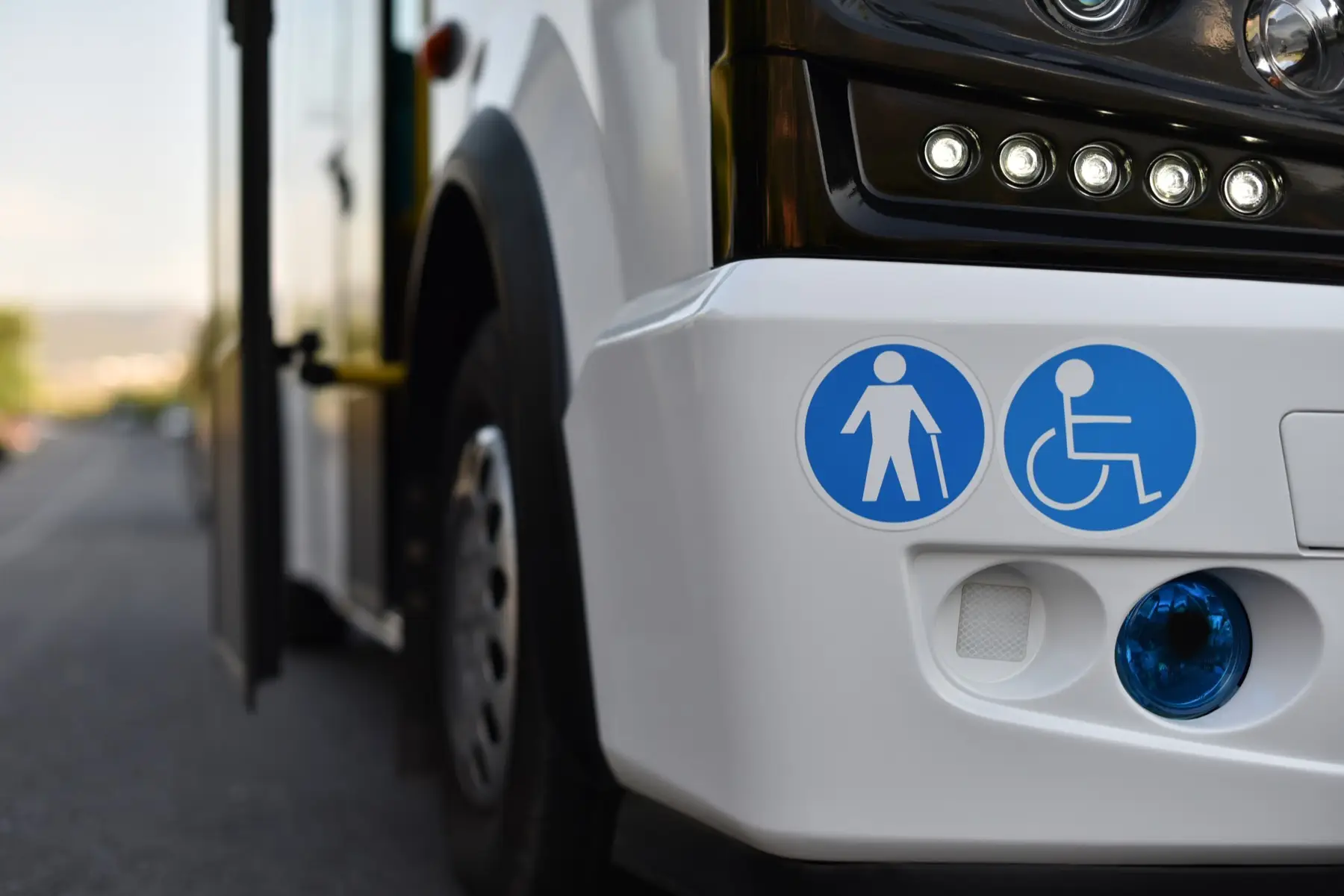 shuttle bus stickers of places for a disabled person and elderly on body of small shuttle bus