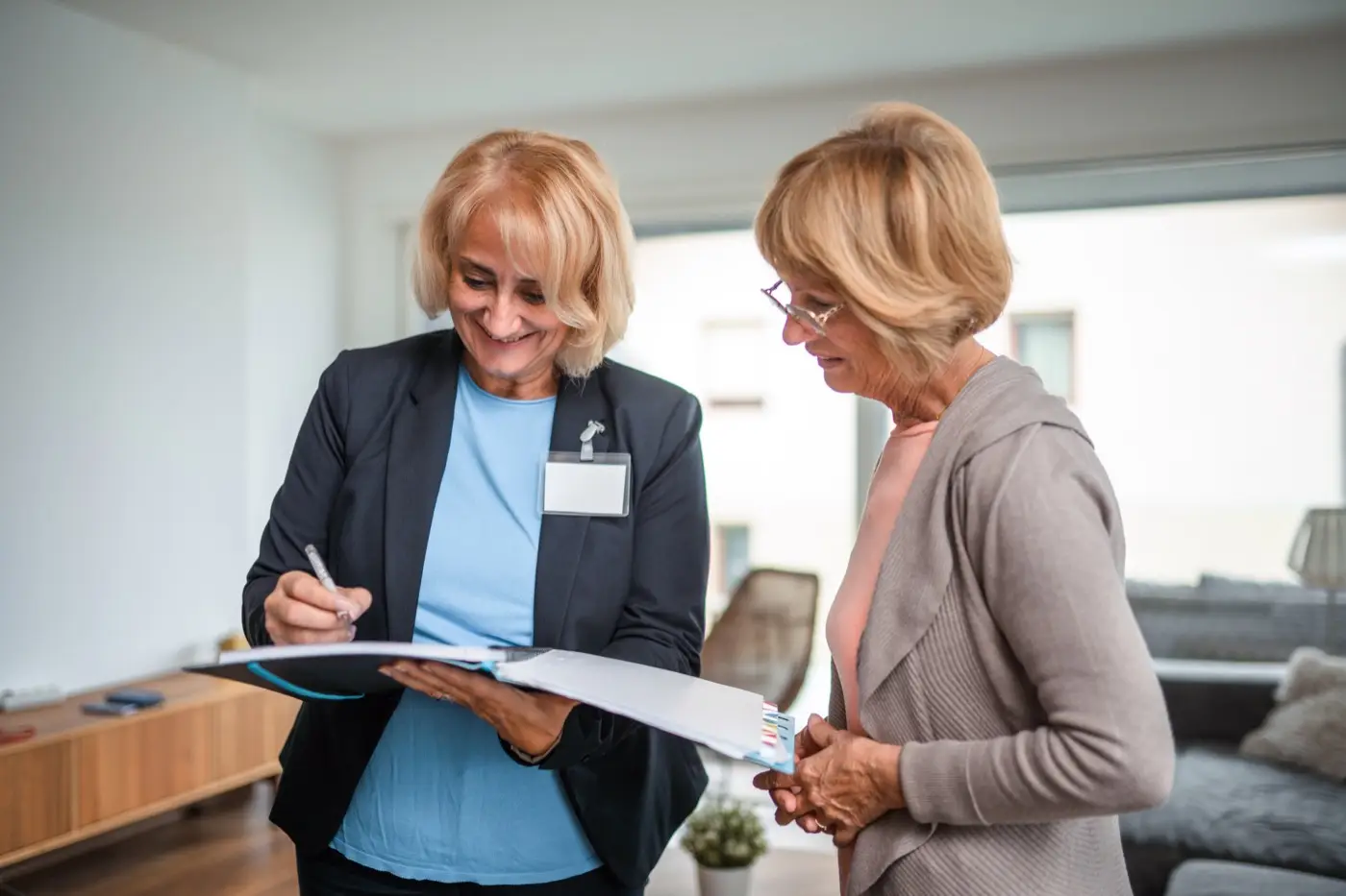 Caucasian Female Healthcare Worker Counseling With a Senior Adult Female Patient at Home Caucasian Female Healthcare Worker Counseling With a Senior Adult Female Patient at Home
